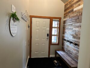 Large entry way with storage, lotโs of coat hangers and ski and snowboard hangers