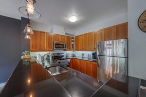 Full size Kitchen with Stove, dishwasher, microwave and fridge